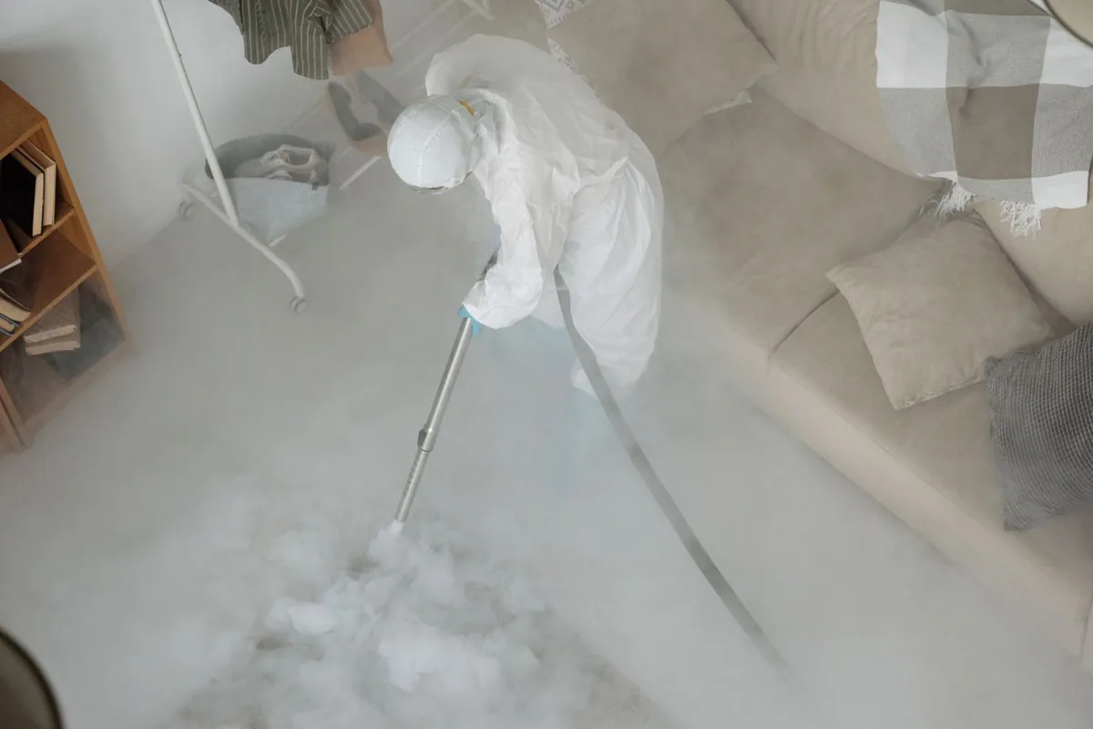 Biohazard cleanup technician in protective equipment, Spencer, MA